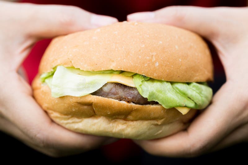 Woman hand hold hamburger royalty free stock photos Woman hand hold hamburger royalty free stock photos