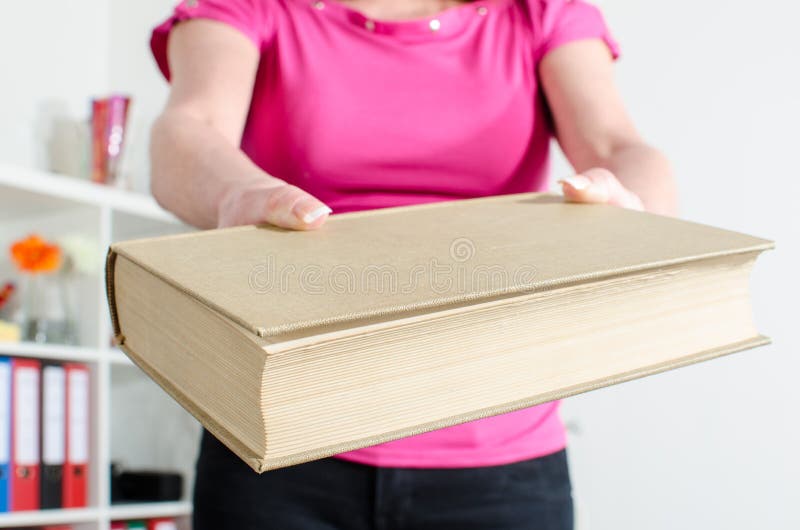 Woman hand holding a book royalty free stock photo