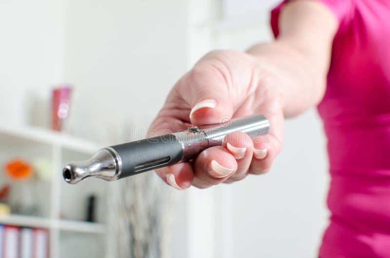 Woman hand holding an e cigarette royalty free stock images Woman hand holding an e cigarette royalty free stock images