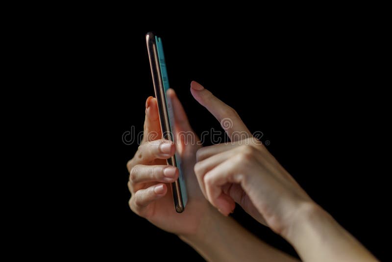 Woman hand holding smartphone. Payment or play royalty free stock photography