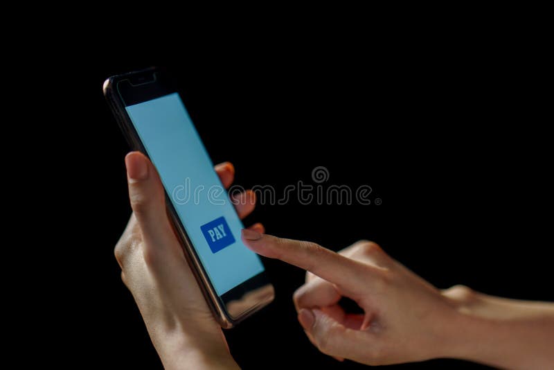 Woman hand holding smartphone. Payment or play stock images