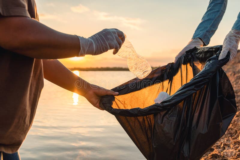 Loads of Trash Bags Sitting Out on the Curb Near a Tree with a Black Picket  Fence and Shrub Background in Urban or Stock Photo - Image of hand, trash:  263643134