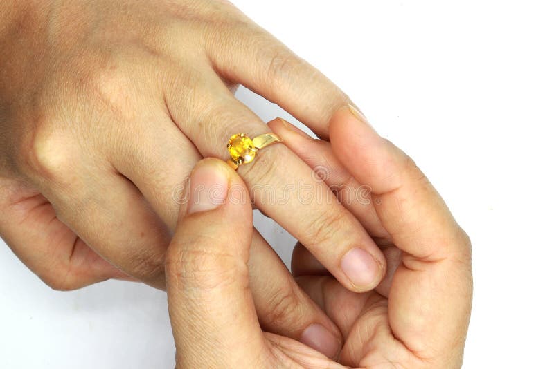 Woman Hand Putting a Wedding Ring Isolated on Black Background Stock Photo  - Image of dose, female: 143016956