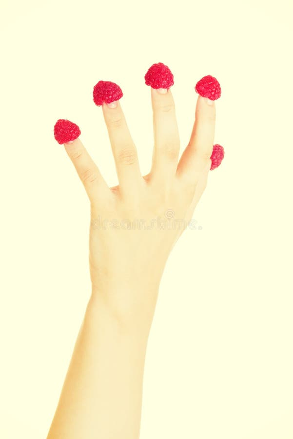 Woman hand with raspberries. royalty free stock image