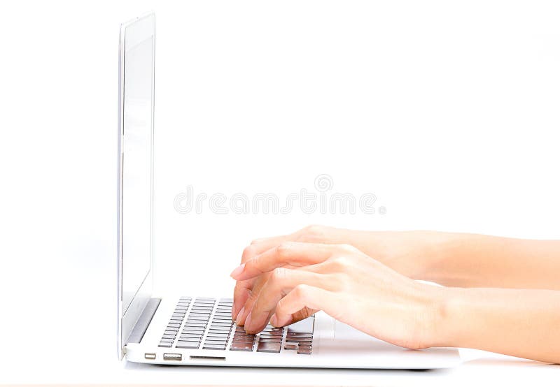 Woman hand typing on the laptop on white table