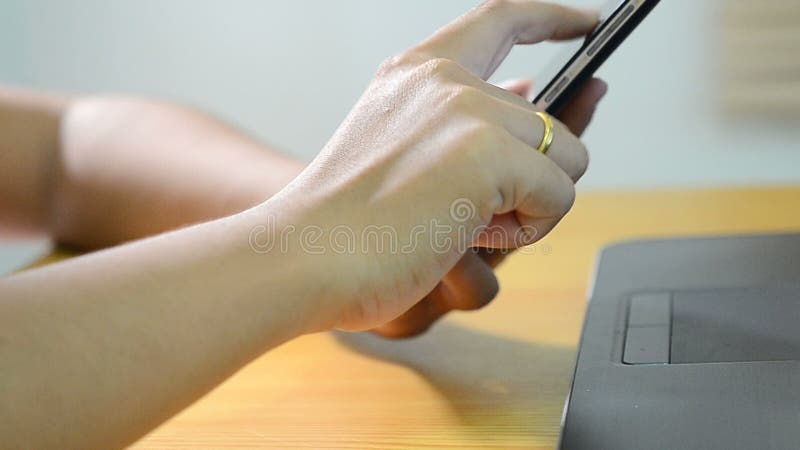 Woman hand using smart phone