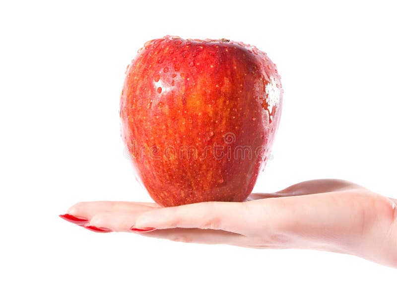 Woman hand with wet red apple