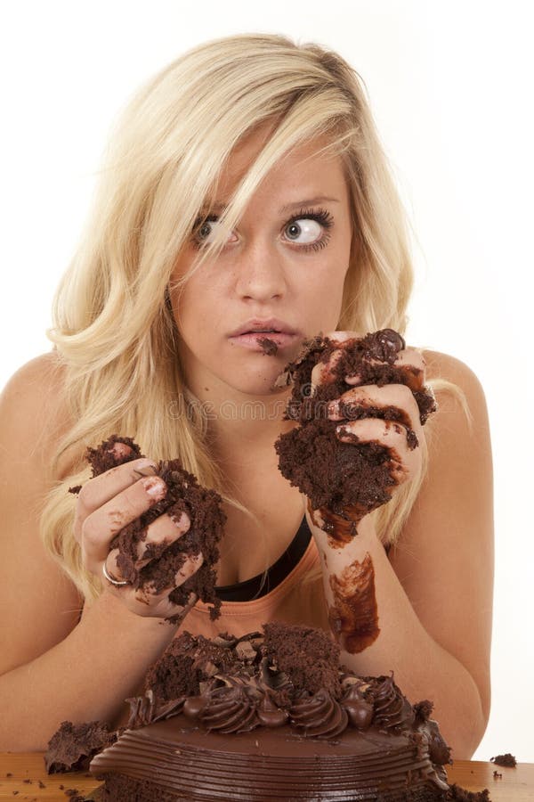 Woman handful of cake caught