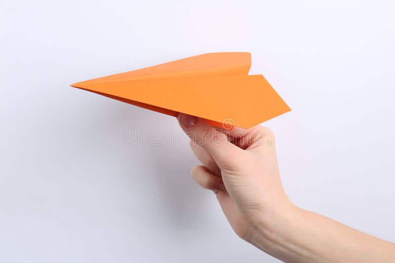 Woman with handmade paper plane on white background closeup imagenes de archivo