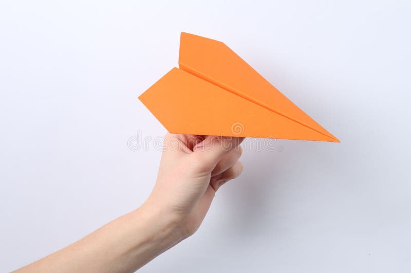 Woman with handmade paper plane on white background closeup fotos de archivo