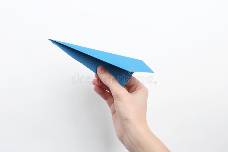 Woman with handmade paper plane on white background closeup imagen de archivo libre de regalías