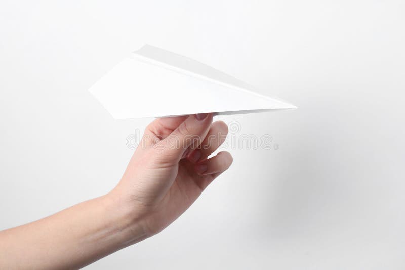 Woman with handmade paper plane on white background closeup fotografía de archivo libre de regalías