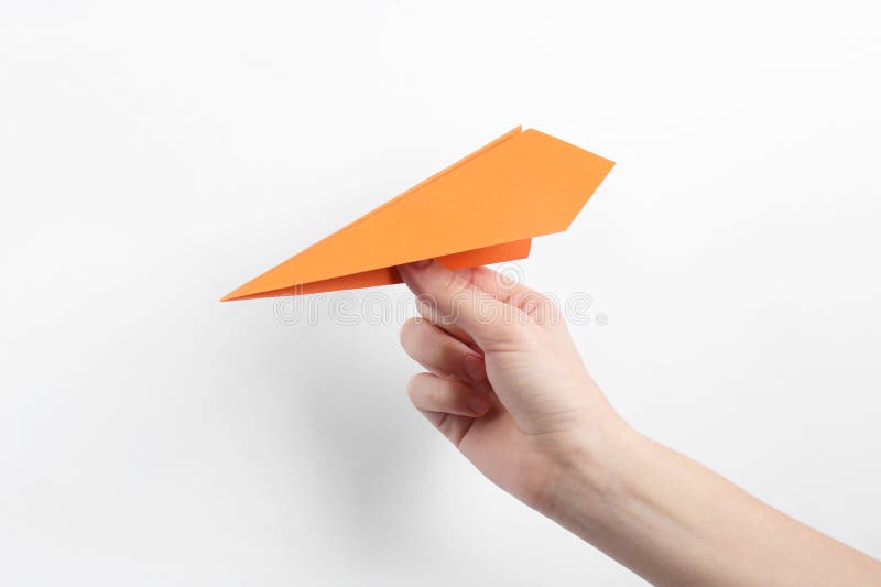 Woman with handmade paper plane on white background closeup foto de archivo