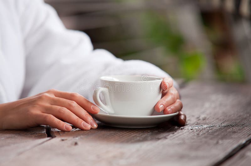 Woman hands with cup of morning tea royalty free stock photo