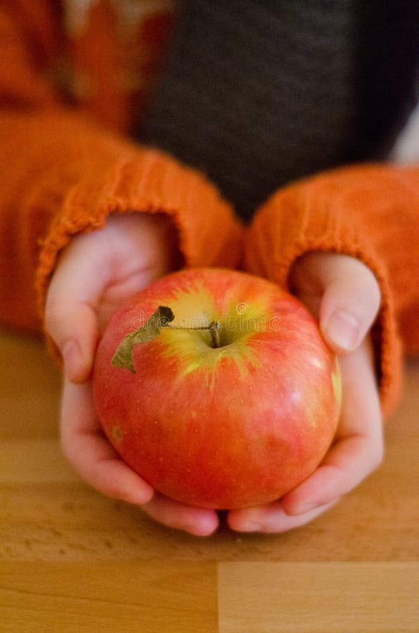 Woman hands holding apple