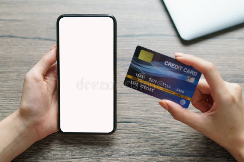 Woman hands holding cradit card and smartphone blank screen royalty free stock image