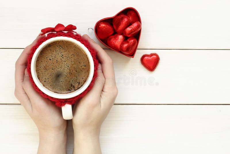 Woman hands holding cup of coffee