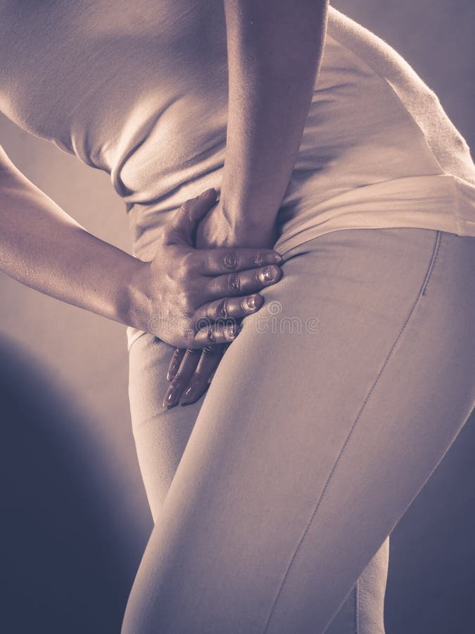Woman with hands holding her crotch stock photo Woman with hands holding her crotch stock photo