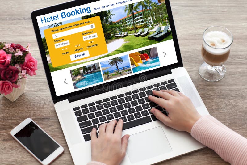 Woman hands on laptop keyboard with online search booking hotel