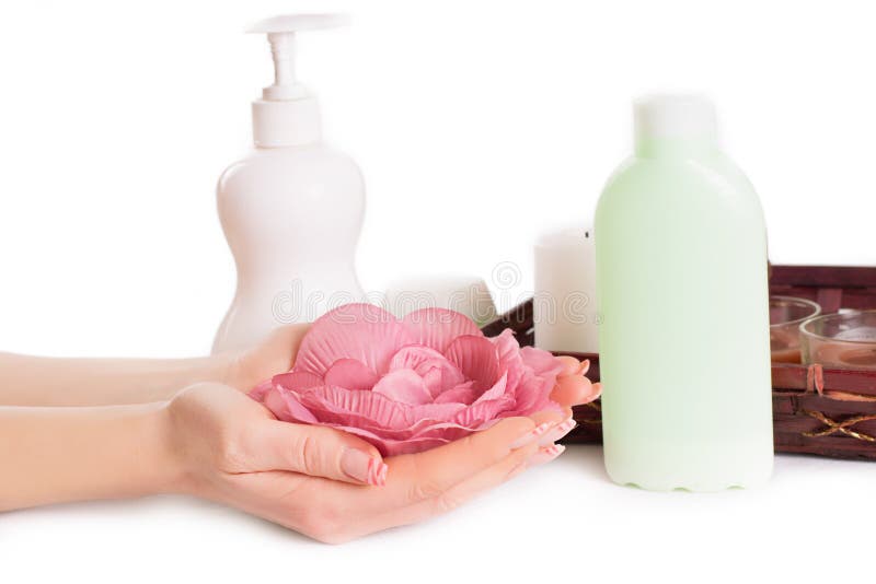 Woman hands with manicure and hand care products