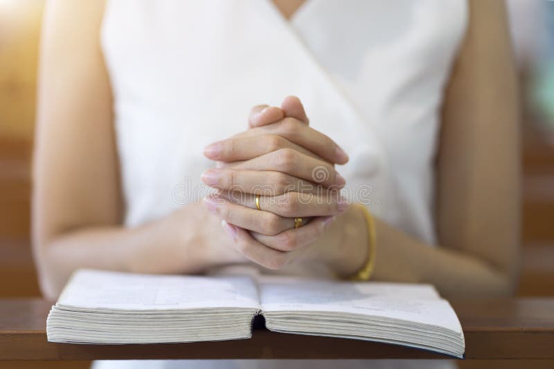 Woman hands praying on a holy bible in church for faith concept, Spirituality and Christian religion royalty free stock photos Woman hands praying on a holy bible in church for faith concept, Spirituality and Christian religion royalty free stock photos