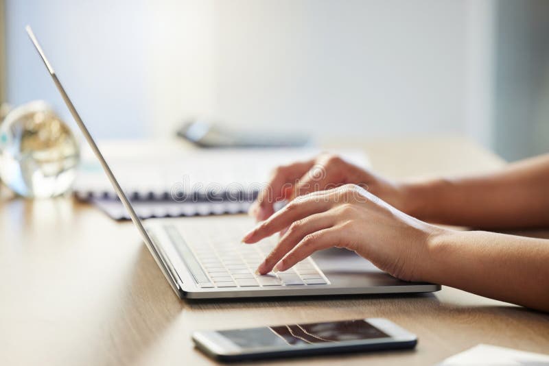Woman, hands and typing on laptop at desk, email business contact and editing proposal in office. Communication, professional administration and bookkeeping spreadsheet in workplace, web and report. Editing project stock images, royalty-free photos and pictures