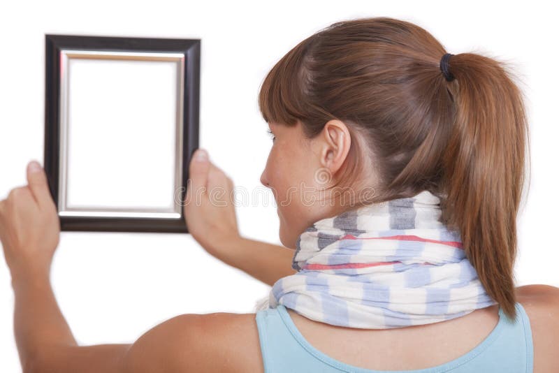 Woman hanging photo frame