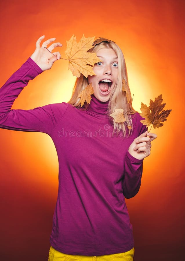 Woman happy autumn in autumn park. Autumn discounts on lingerie. Sale of womens panties. Leaf fall. Happy young woman royalty free stock photo Woman happy autumn in autumn park. Autumn discounts on lingerie. Sale of womens panties. Leaf fall. Happy young woman royalty free stock photo