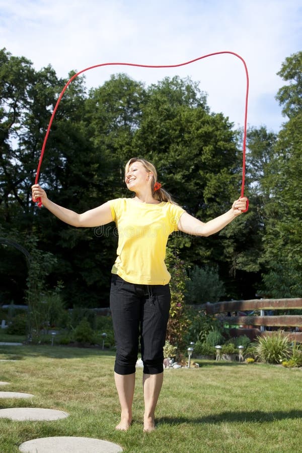 Woman Has Fun with Jumping Rope Stock Photo Image of nature, outdoors 33099312