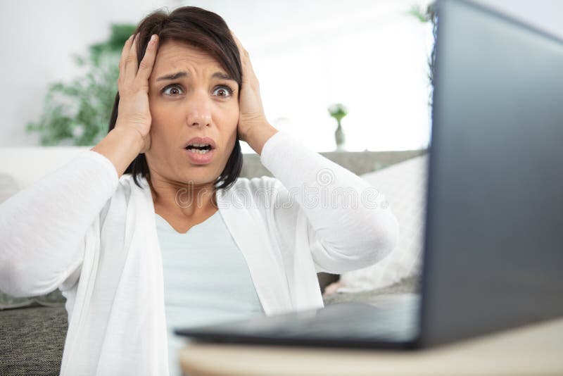 Woman has suffered technological disaster on laptop royalty free stock photo