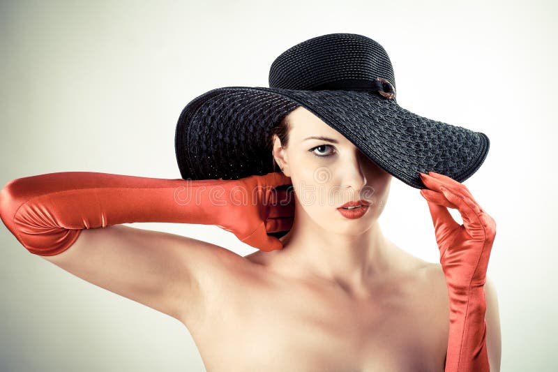Woman in a hat and gloves stock image. Image of bright 32561611