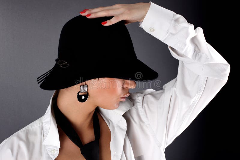 Woman in hat hiding eye