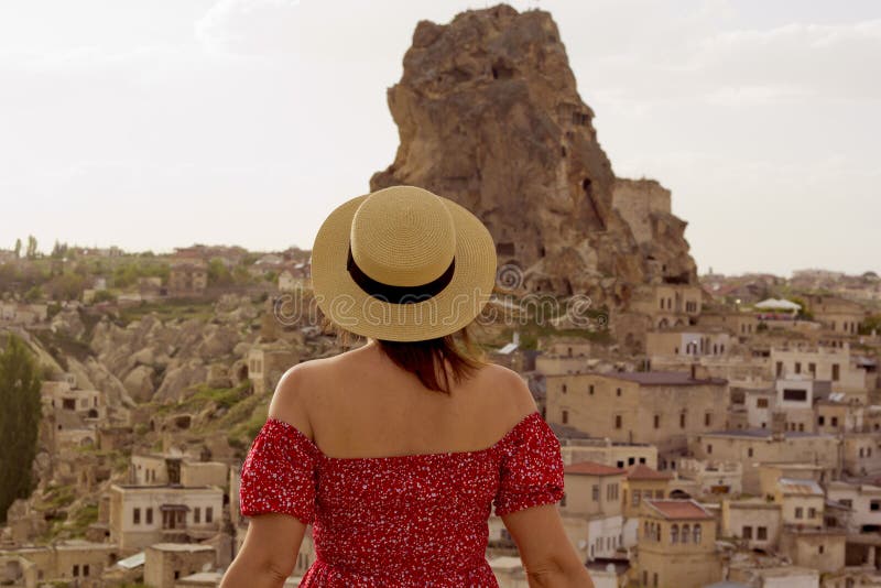Woman in a Hat Looking To the Castle in Cappadocia, Turkey Stock