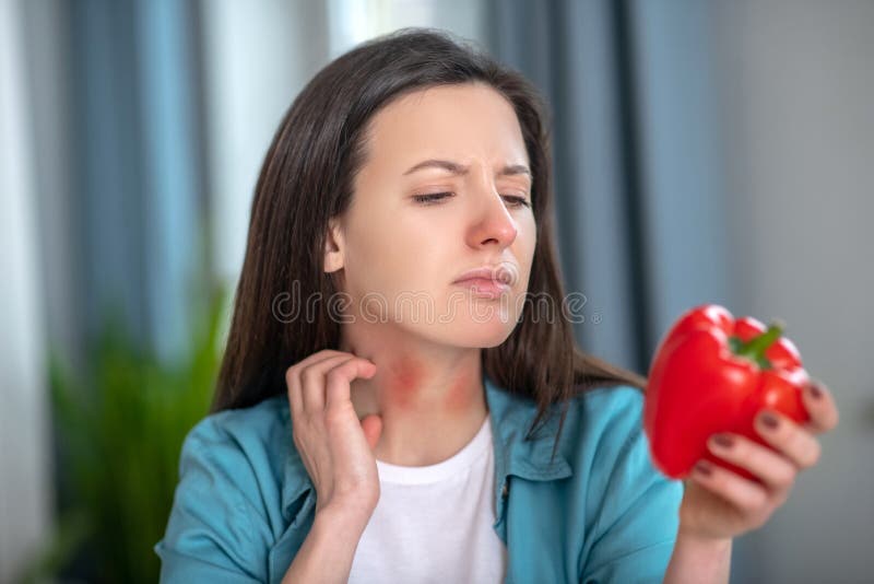 Woman Having an Allergy for a Sweet Pepper Stock Photo Image of meal