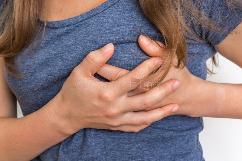 Woman having chest pain, heart attack stock photography Woman having chest pain, heart attack stock photography