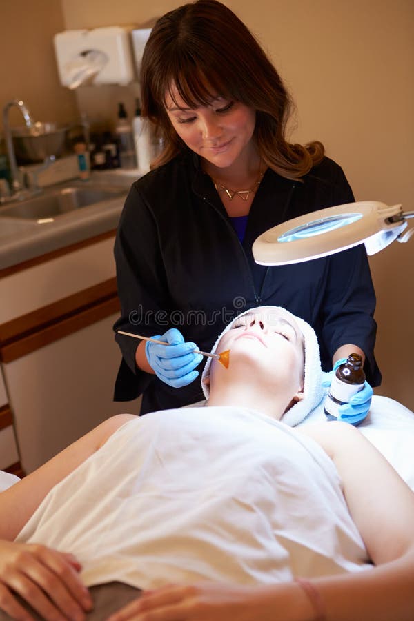 Woman Having Dermo Abrasion Cosmetic Treatment At Spa