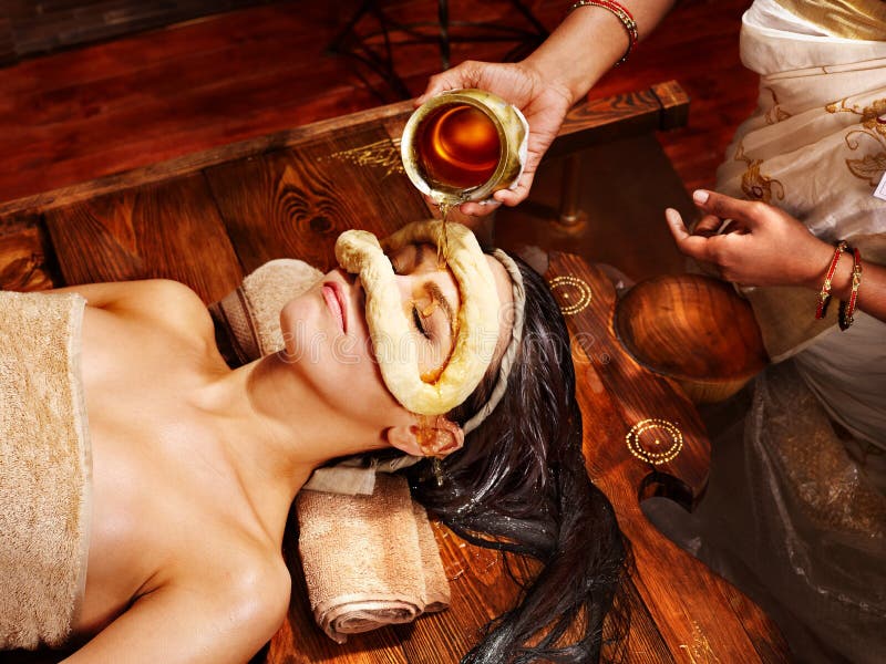 Woman having mask at ayurveda spa.