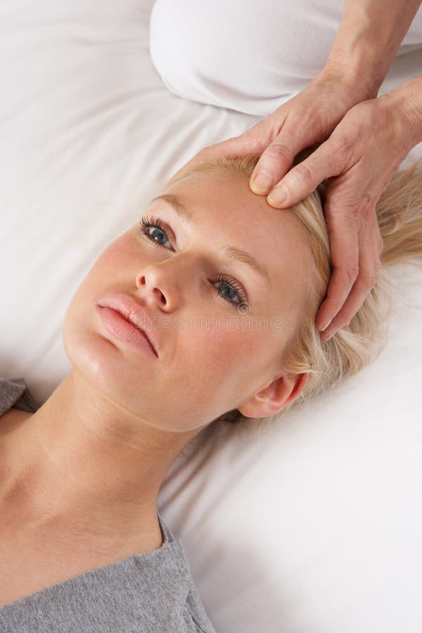 Woman having Shiatsu massage to head stock photos Woman having Shiatsu massage to head stock photos