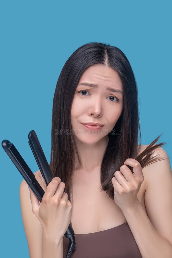 Straightening the Ends of the Hair by a Hairdresser, Haircut in a