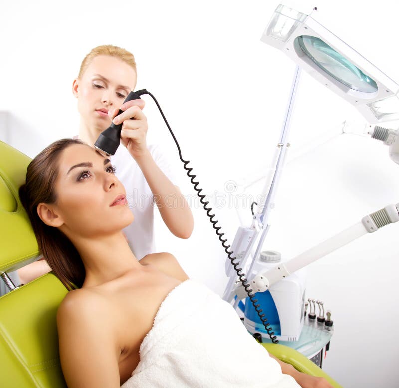 Woman Having A Stimulating Facial Treatment From A Therapist Stock