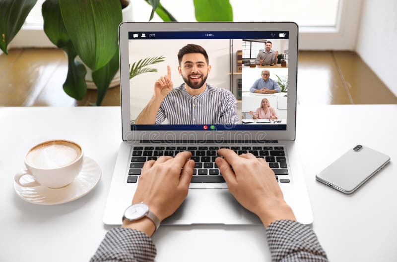 Woman having video chat with team at table, closeup stock photos