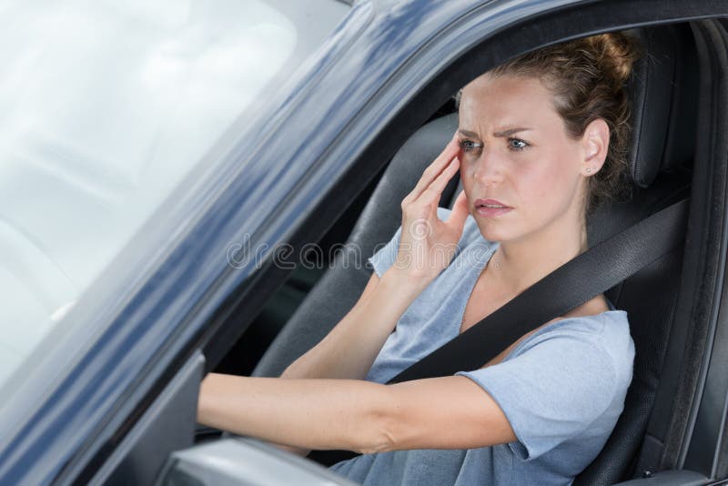 Woman with headache in car stock photo. Image of beautiful 207980810