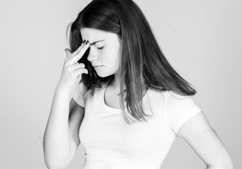 Woman with headache pain. Young woman holding her aching head. black and white royalty free stock images Woman with headache pain. Young woman holding her aching head. black and white royalty free stock images
