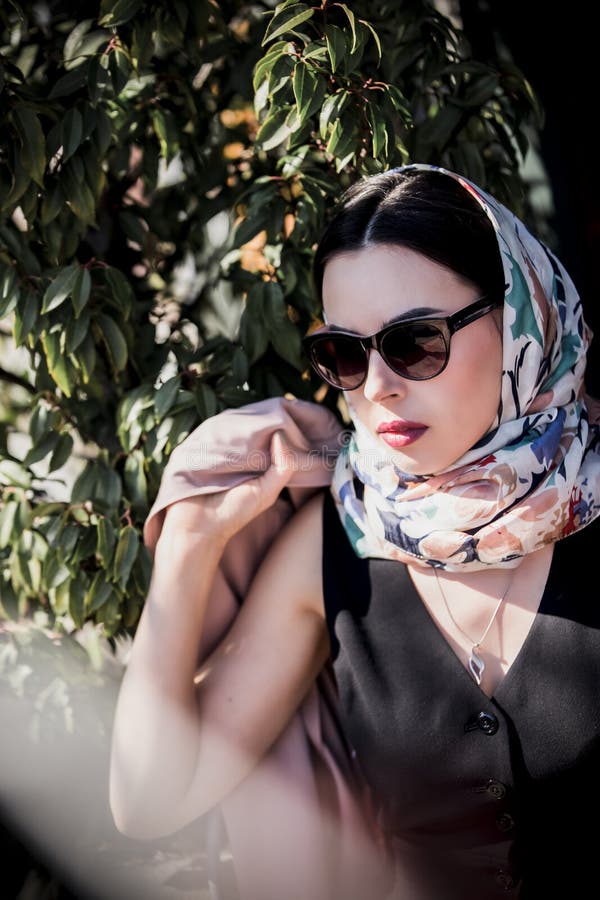 Woman in Headscarf and Coat with Sunglasses Near Coffee Shop Stock ...