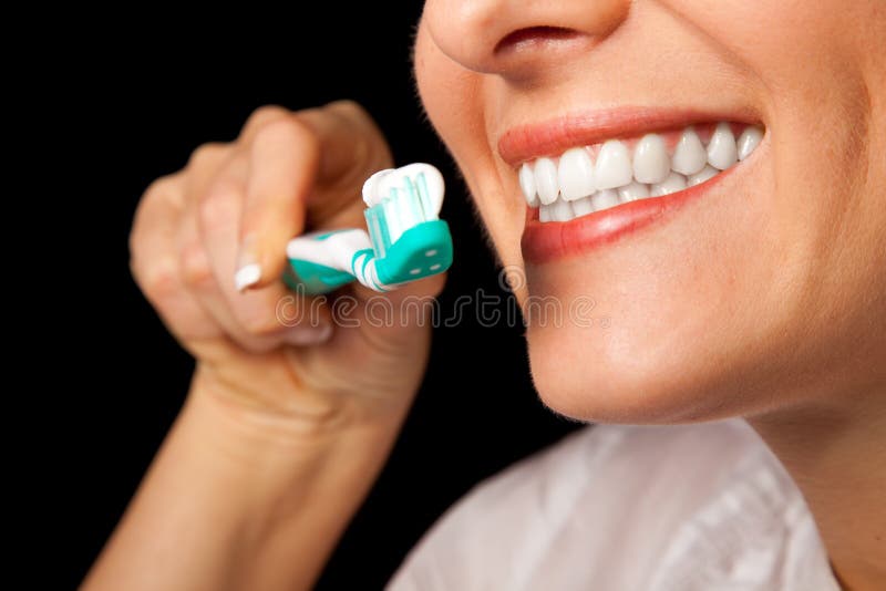 Woman healthy teeth closeup on black