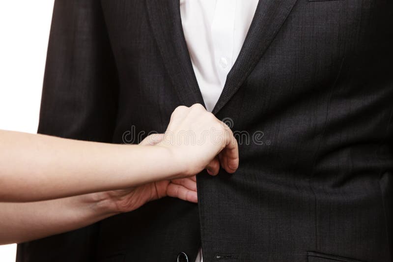 Woman helping man dress up elegant clothes.