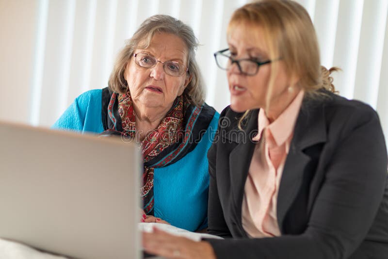 Woman Helping Senior Adult Lady On Laptop Computer Stock Image Image Of Together Elderly