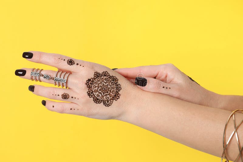 Woman with Henna Tattoos on Hands Against Yellow Background, Closeup. Traditional Mehndi Ornament Stock Image - Image of mehndi, adult: 224945679 Woman with Henna Tattoos on Hands Against Yellow Background, Closeup. Traditional Mehndi Ornament Stock Image - Image of mehndi, adult: 224945679