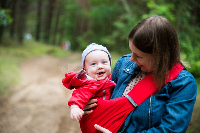 Woman and her infant baby outdoors