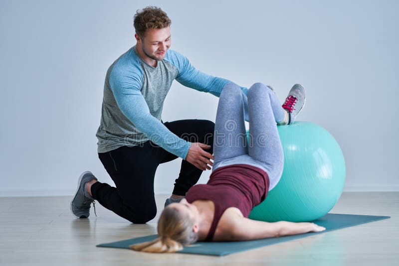 Woman with her personal fitness trainer stock images Woman with her personal fitness trainer stock images